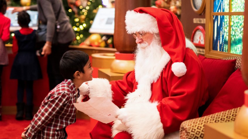 Mall Santa greeting a child