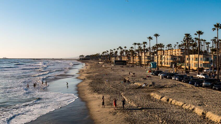Oceanside, California - March 23, 2017: People participate in leisure activities on the popular Southern California beach located in San Diego County.