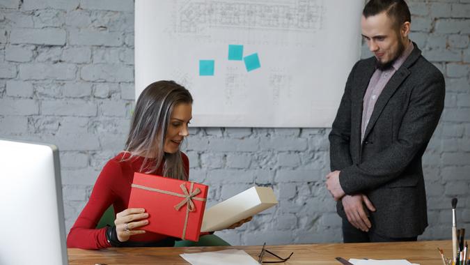 colleague giving his boss a gift-shutterstock_621749798 colleague giving his boss a gift