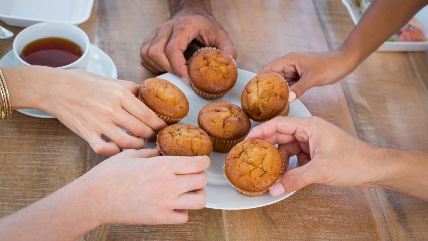 People taking a cupcake after lunch.