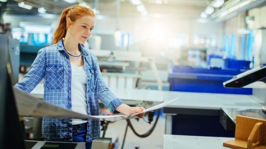 Close up of female working in a printing factory.
