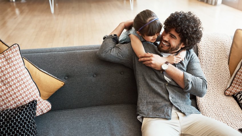 Shot of a father and his little daughter bonding together at home.