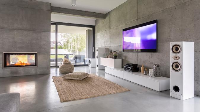 Tv living room with window Tv living room with window, fireplace and concrete wall effect.