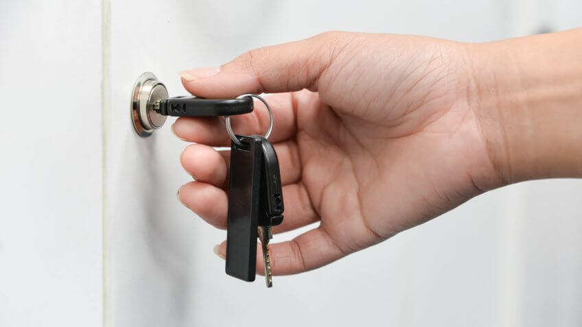 Unlocking the cabinets with key.