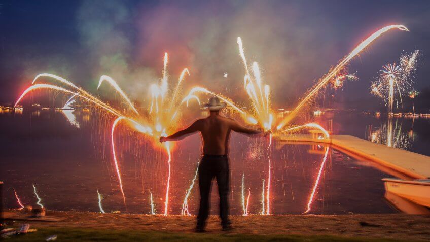 man holding Roman candle fireworks