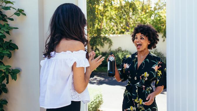 party guess arriving with wine gift-shutterstock_767395645 party guess arriving with wine gift