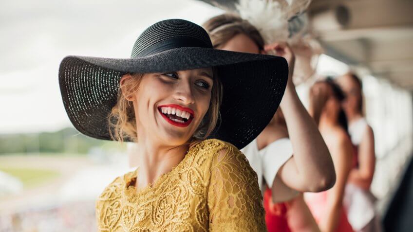 A young beautiful woman on ladies day, smiling and laughing at friends.