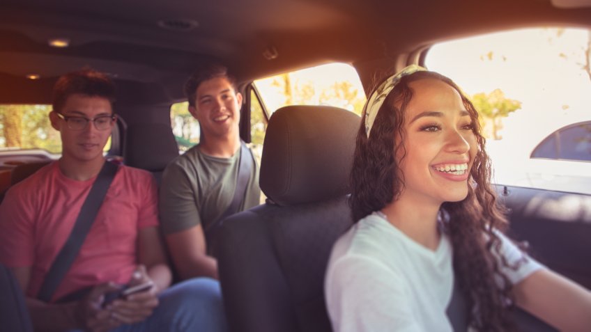 Young 20 somethings riding together in a car.