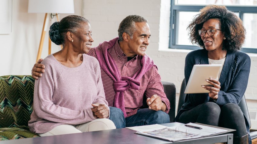 Home consultation for senior couple.