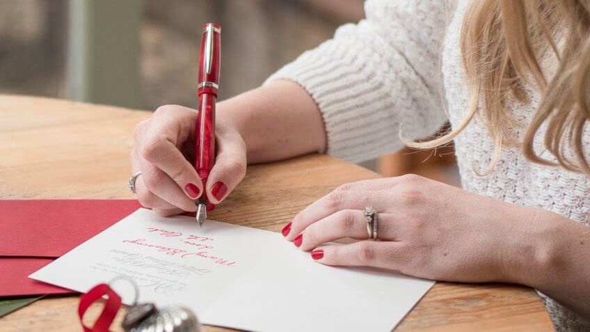 woman writing a gift note