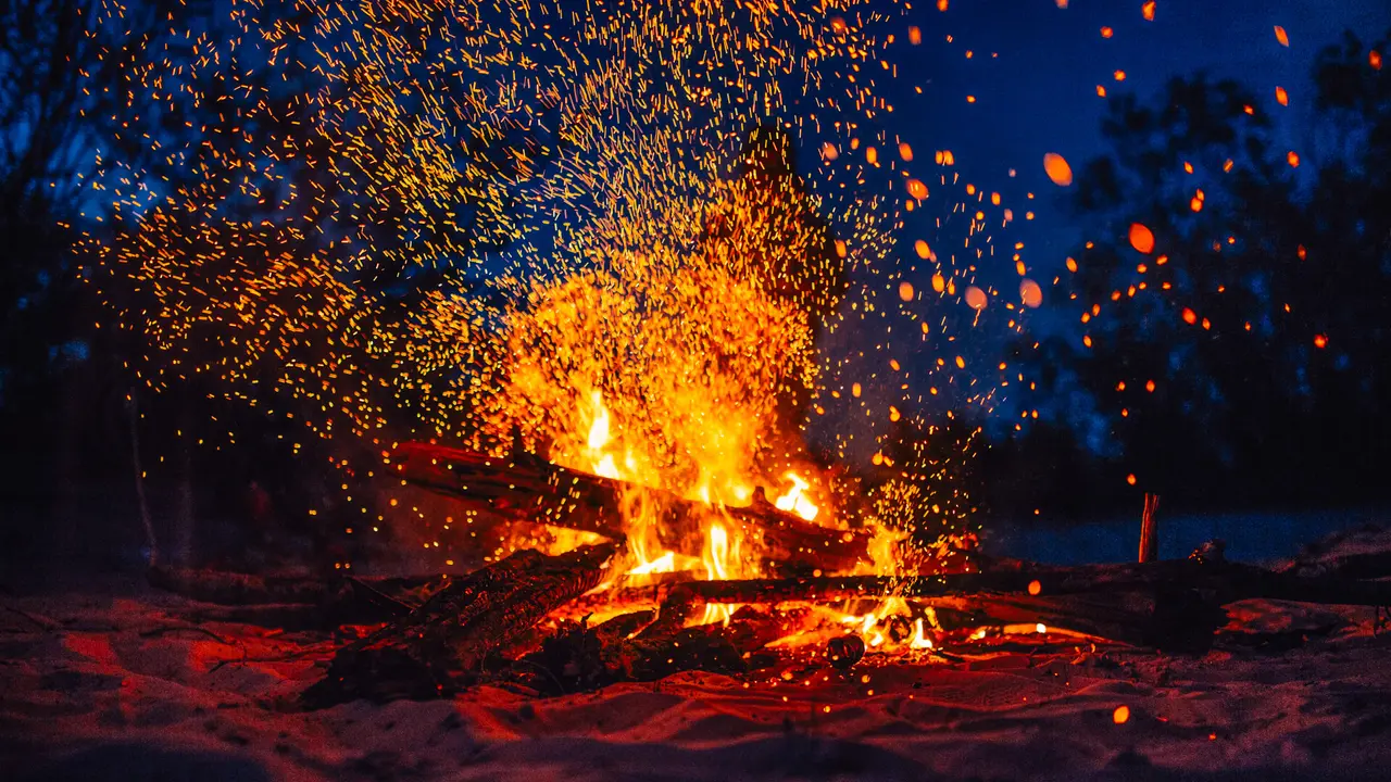 https://cdn.gobankingrates.com/wp-content/uploads/2019/07/00-Summer-beach-bonfire-with-sparks-flying-around-iStock-1125476482.jpg?webp=1&w=1280&quality=75