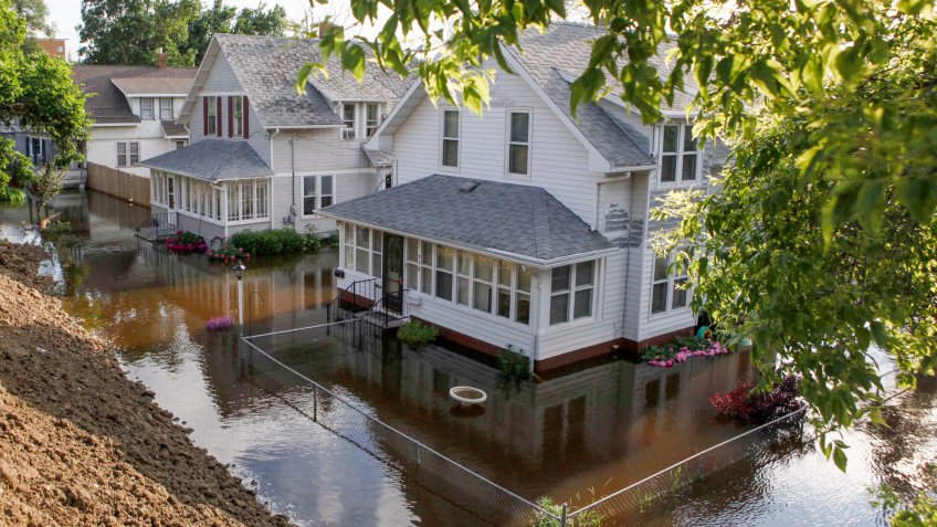 Mandatory Credit: Photo by Charles Rex Arbogast/AP/Shutterstock (6276267ad)Floodwaters from the Souris River surround homes on 3rd St.