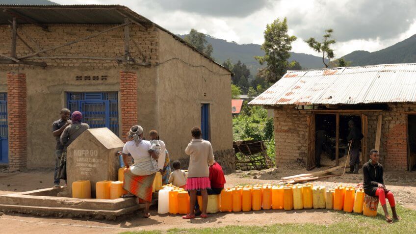 Musanze, Rwanda - November, 16, 2018: jerrycans in line waiting to be filled at the waterpump.