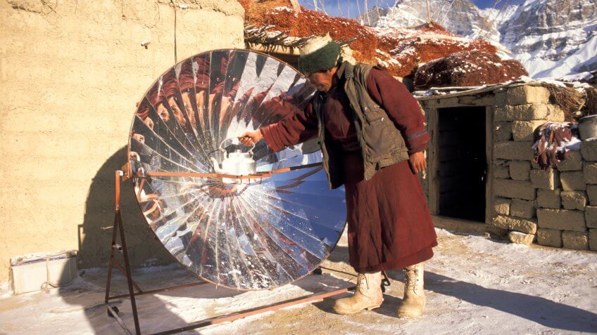 man with solar cooker, Zanskar, Ladakh, India