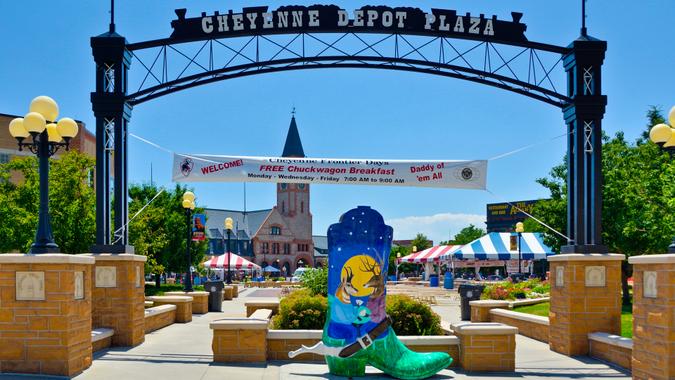 Cheyenne Frontier Days Cheyenne, Wyoming, USA - July 21, 2013: People near the entrance to the Cheyenne Depot Plaza, city park in downtown Cheyenne.