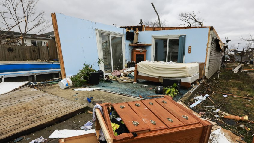 Mandatory Credit: Photo by Tannen Maury/EPA/Shutterstock (8451015h)Damaged furniture lies behind in the aftermath of a tornado as cleanup begins in Naplate, Illinois, USA, 01 March 2017.
