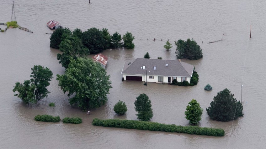 Mandatory Credit: Photo by Nati Harnik/AP/Shutterstock (6275787a)A home is engulfed by flood water in Hamburg, Iowa from the rising Missouri River.