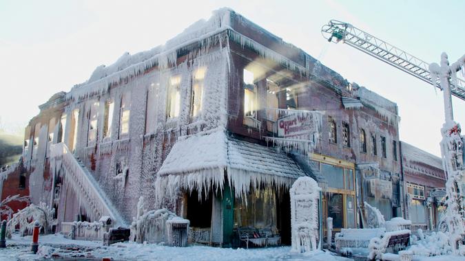 Mandatory Credit: Photo by Nati Harnik/AP/Shutterstock (6141304b)Sunlight streams through the windows of a building which caught on fire in Plattsmouth, Neb.