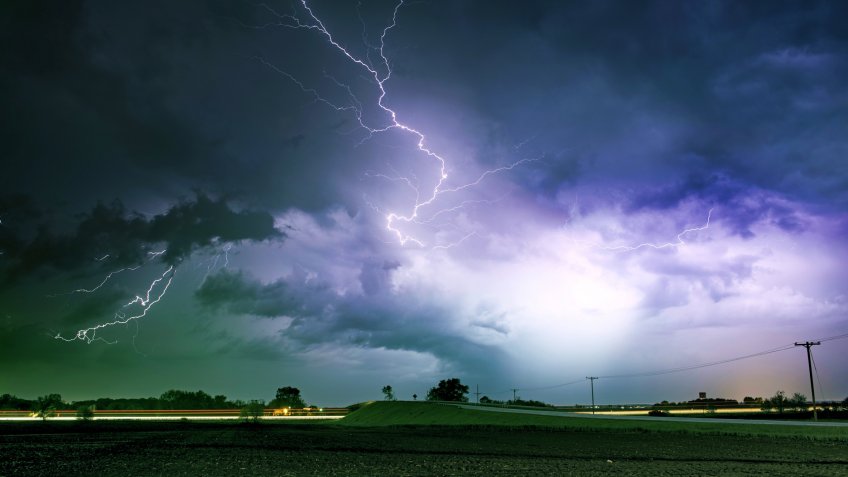 Tornado Alley Severe Storm at Night Time. Severe Lightnings Above Farmlands in Illinois, USA