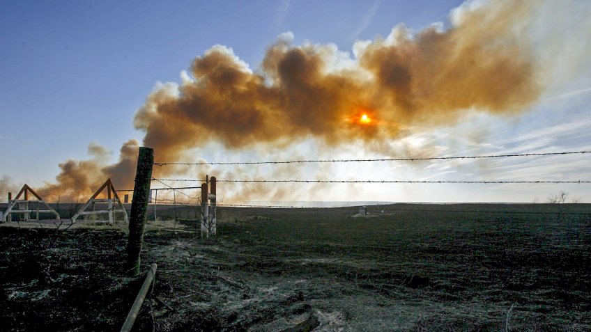 Mandatory Credit: Photo by Larry W Smith/EPA/Shutterstock (7878877e)A Wildfire Burns in the Distance Near Mclean Texas Tuesday 14 March 2006 Eleven Fires Tuesday Burned Across an Estimated Nearly 700 000 Acres of Land in the Texas PanhandleUsa Texas Wildfires - Mar 2006.