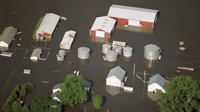 Mandatory Credit: Photo by Charlie Neibergall/AP/Shutterstock (6550637a)A rural Colfax, Iowa, farm is surrounded by flood waters, Central Iowa was hit by heavy flooding in Colfax, Iowa, on after weeks of heavy rain in the upper MidwestFloods U.