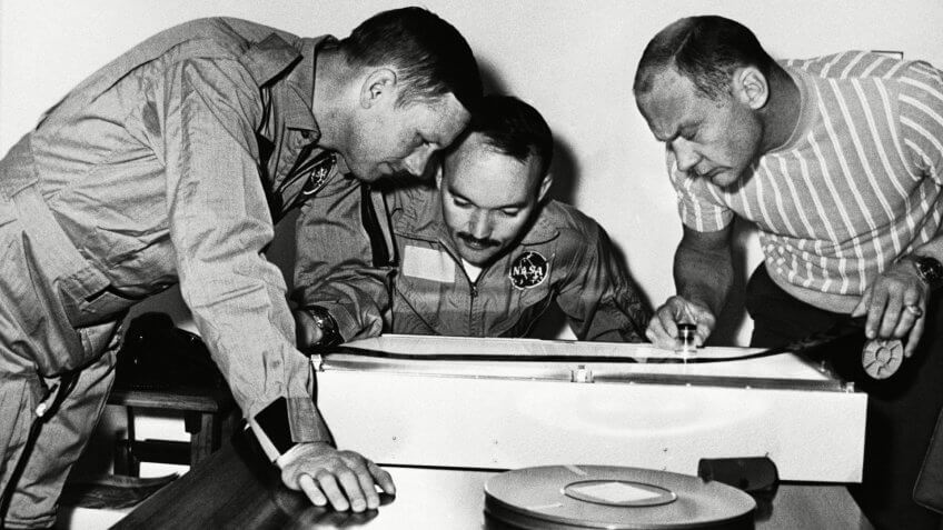 Apollo 11 astronauts examine film