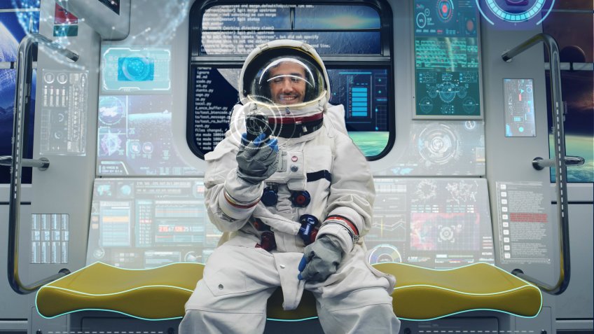 Astronaut sitting in space shuttle
