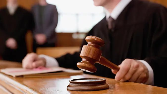30-34 Years, 40-44 Years, 50-54 Years, Authority, CONCLUSION, COURT, COURTHOUSE, Casual Clothing, Caucasian, Color Image, Courtroom, DECISION, Focus On Foreground, Gavel, Hands Clasped, Head And Shoulders, Holding, Horizontal, Indoors, JUDGE, Law, Legal System, London, MAN, Mature Adult, Mature Men, Mid Adult, Mid Adult Women, Occupation, People, Photography, SENTENCE, SYSTEM, Standing, TRIAL, Three People, United Kingdom, VERDICT, Waist Up, day, detail, front view, hammering, judgment, judicial, justice, justness, law court, legal, legal magistrate, legal profession, pounding, robe, ruling, side view, sitting, truth, woman