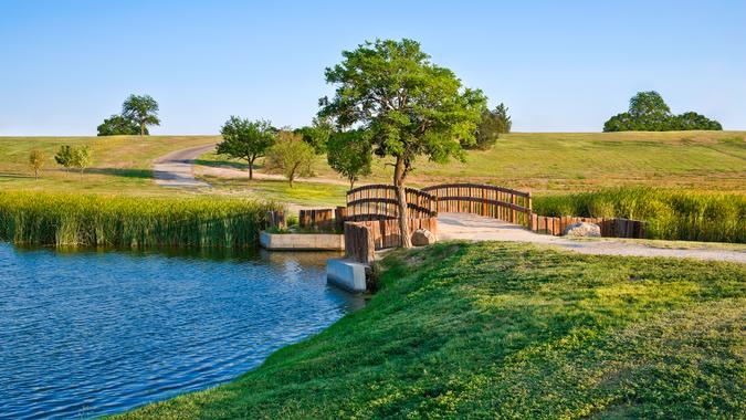 summer footbridge and lake In Lubbock Texas.