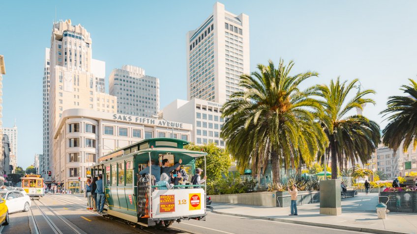 SEPTEMBER 4, 2016 - SAN FRANCISCO: Traditional Powell-Hyde cable cars at Union Square in central San Francisco in beautiful golden morning light, California, USA.