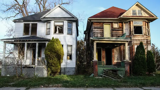 Abandoned houses in an urban setting.