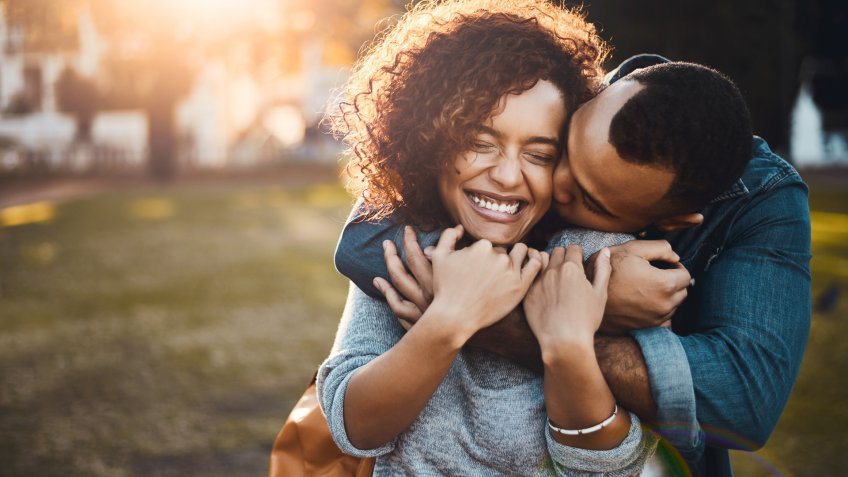 Shot of an affectionate young couple bonding together outdoors.