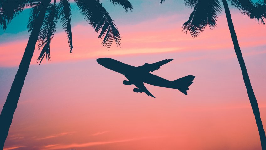 Retro Style Photo Of Plane Over Tropical Scene.