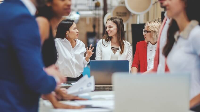 Group of business people in the office meeting.