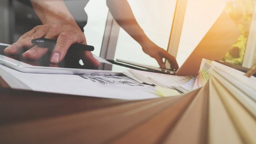 contractor reviewing home renovation plans and budget