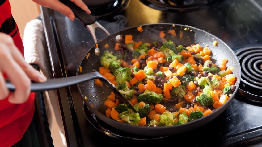 "Black beans, sweet potatoes, broccoli, garlic and olive oil in a pan.