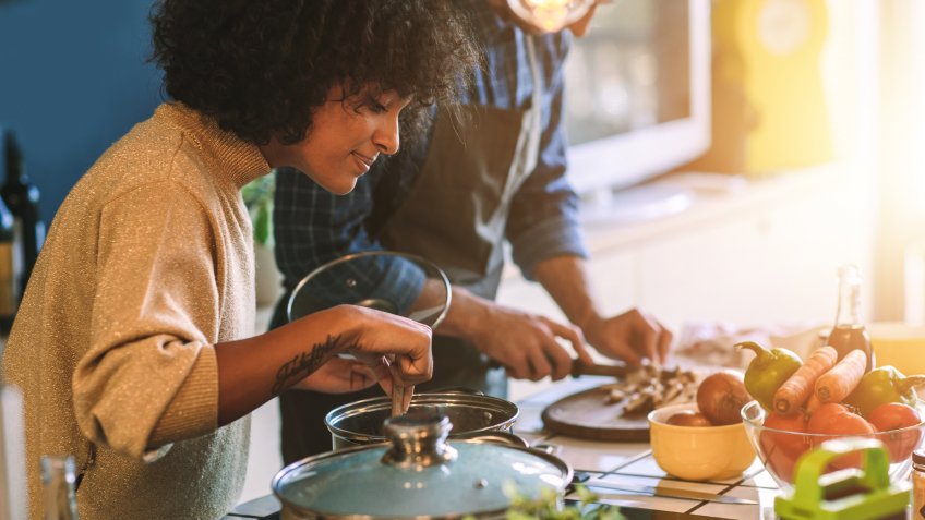 Friends Living And Cooking Together.