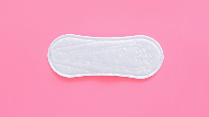 disposable sanitary pad on ping background