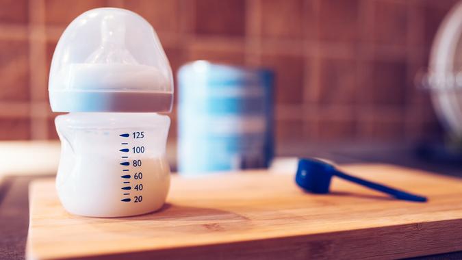 Baby formula in milk bottle for a newborn baby feed.