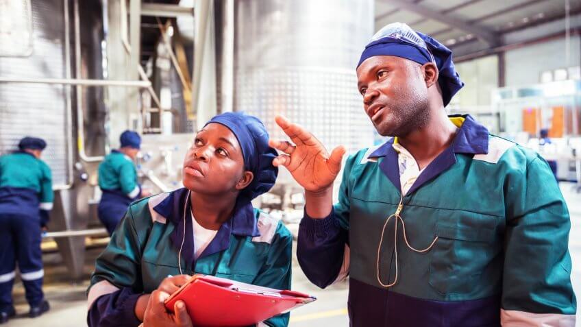 Factory, Inspection, Supervisor, Training - Factory Workers in Africa attending to their routines.