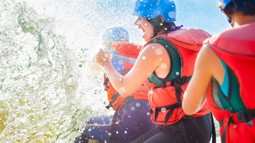 family white water rafting with safety vests