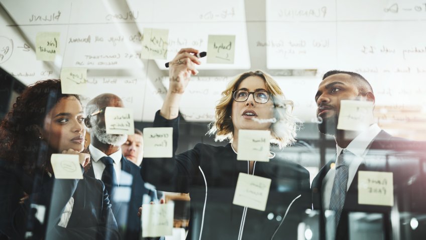 Shot of a group of businesspeople having a brainstorming session in a modern office.