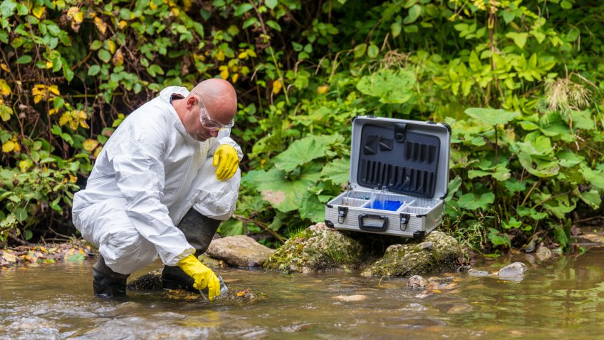 Scientist examing toxic water.
