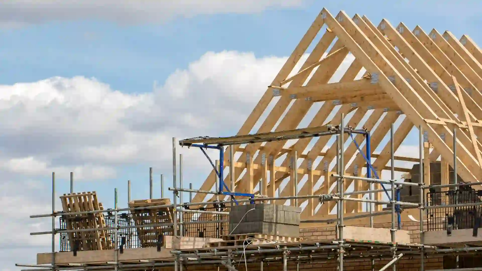 Ongoing construction of a house to showcase the industry and state of the housing market on new builds for stock photo.