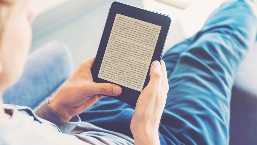 man reading an e-reader