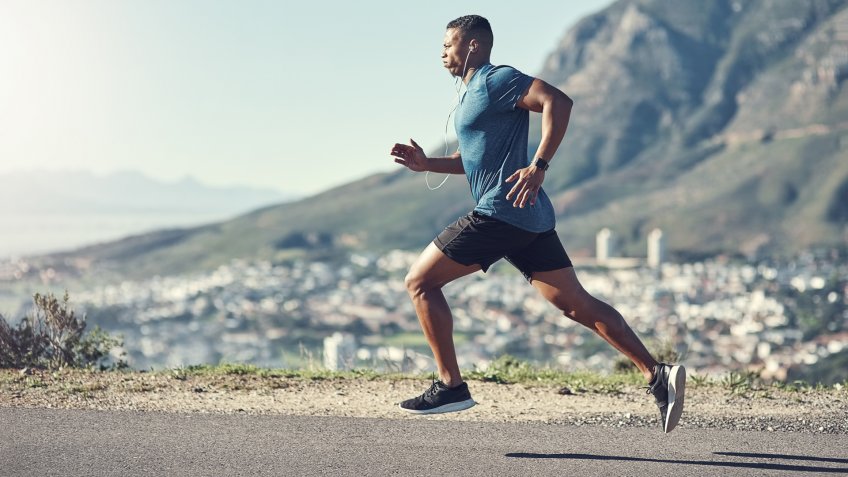 Shot of a young handsome man running outdoors.