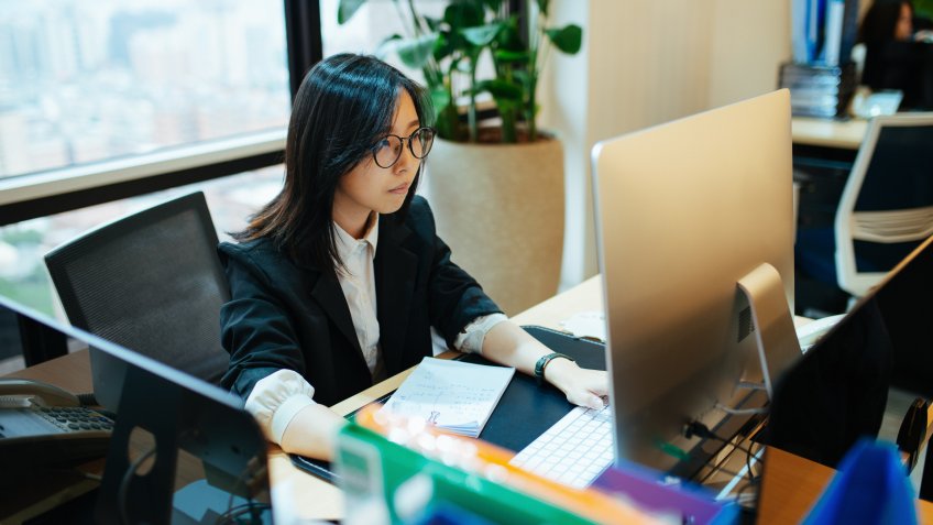 Young millennial business people developing investment ideas, dealing with finances and start-up assets.