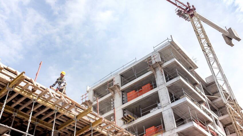 A new building is being constructed with use of tower crane.