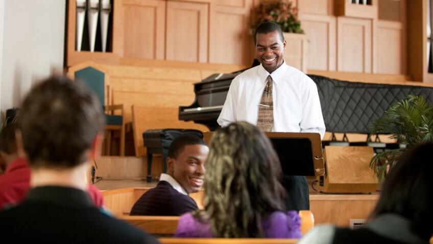 A group of people listening to a sermon in church - Buy credits.