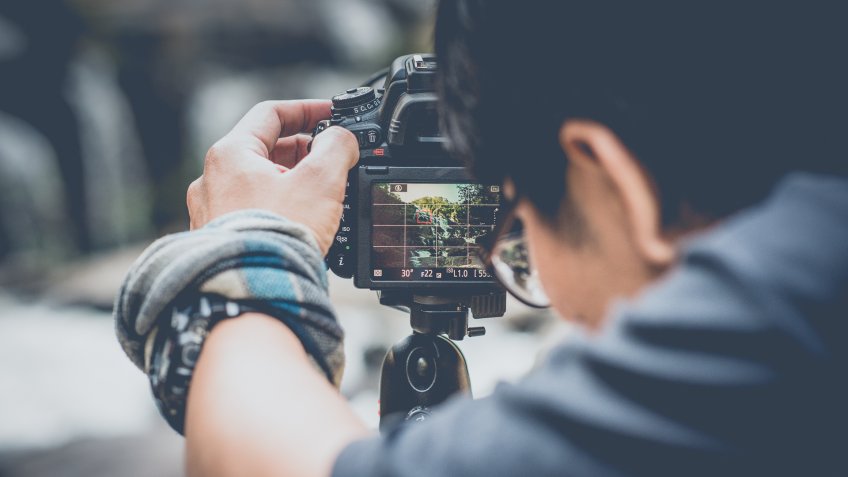 photographer capturing nature for stock photos